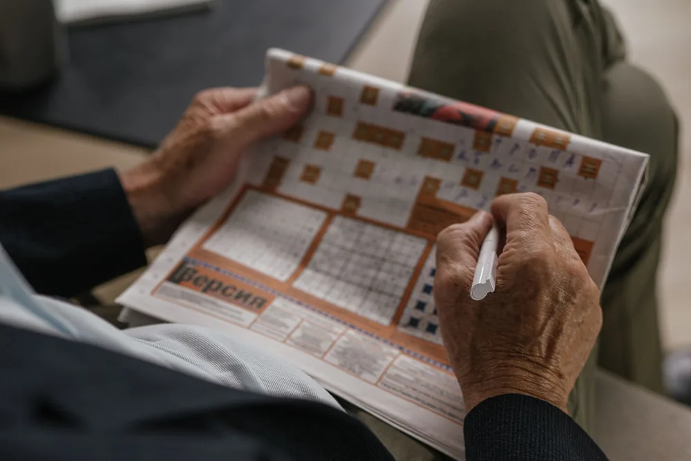 A man working on a crossword puzzle