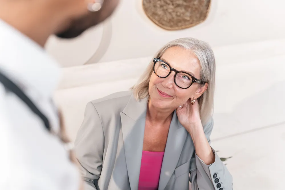A woman in her sixties in conversation with a health professional